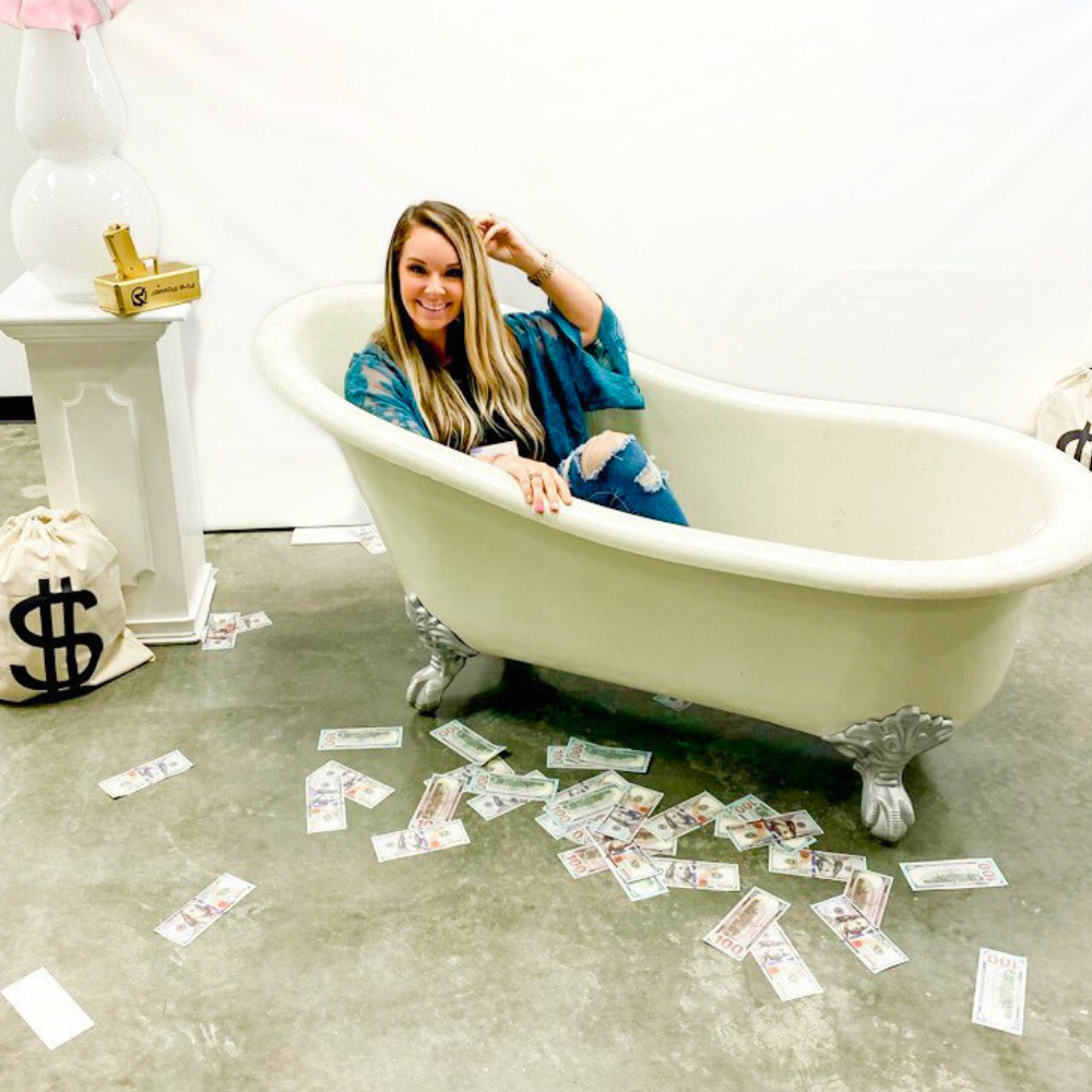 Boutique brand owner relaxing surrounded by cash from email-driven revenue